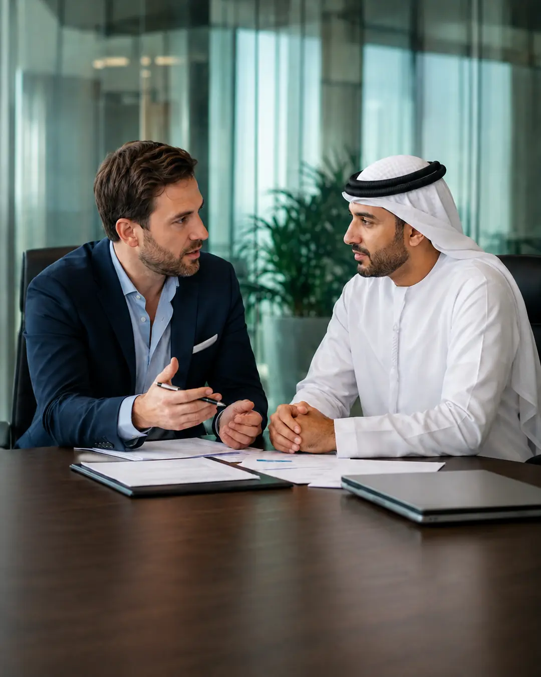 Business advisor consulting with an international founder in a modern UAE office